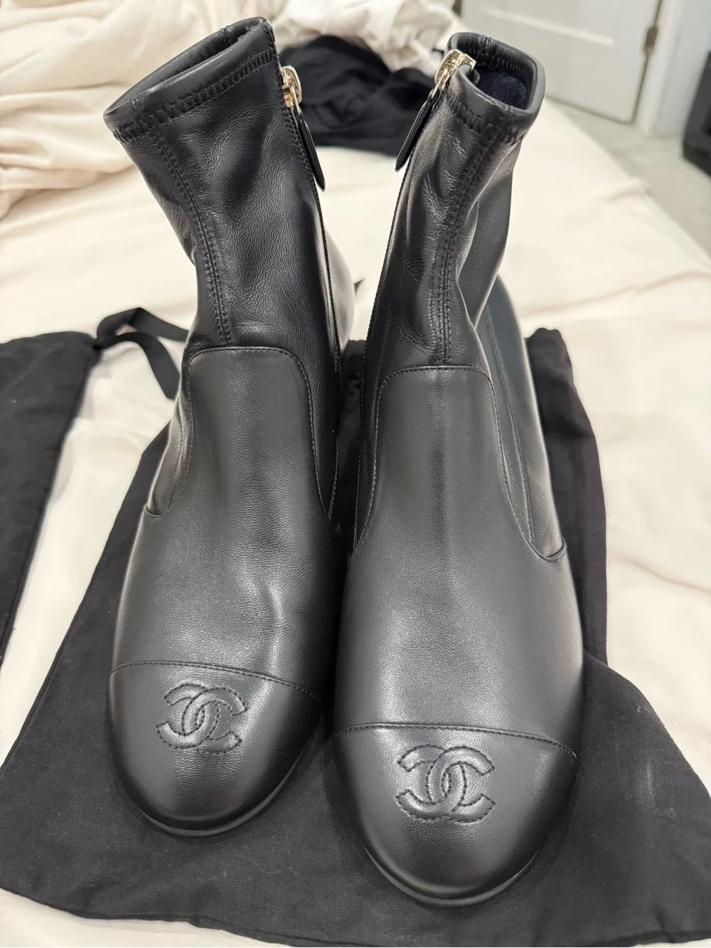 CHANEL Black Leather Ankle Booties with Embossed CC Cap